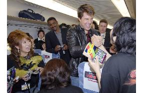 Tom Cruise entertain fans on bullet train