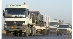 GSDF armored trucks leave Iraq's Samawah
