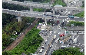 2 killed after car falls off highway and jumps over train tracks