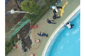 Police examine pool in Saitama