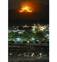 Giant bonfire lights up Kyoto mountain