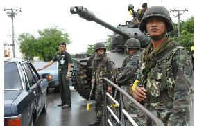 Military seizes power in Thailand in coup, ousts Thaksin