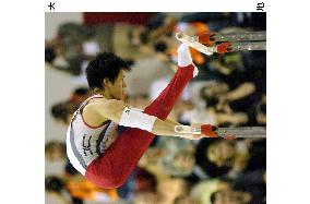 Tomita takes silver in parallel bars at worlds