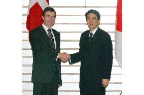 Denmark's Prime Minister Rasmussen talks with Abe