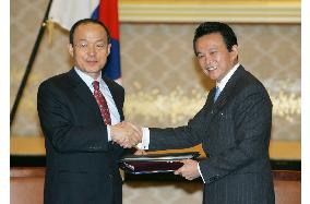Japan, S. Korea formalize legal assistance treaty