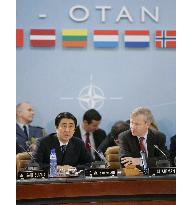 Abe tells NATO Japan won't shy from sending troops for int'l peace