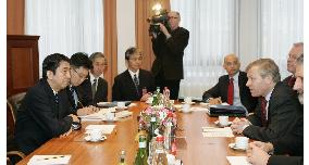 Abe tells NATO Japan won't shy from sending troops for int'l peace
