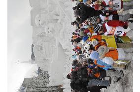 Snow festival begins in Sapporo despite snow shortage, rain