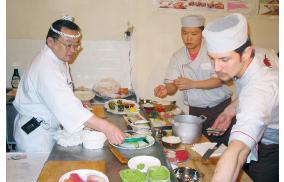 Japanese sushi chefs perform sushi making in Moscow