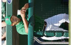 Matsuzaka wears green cap, shirt