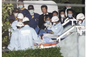 Police burst into Tokyo apartment, arrest armed man