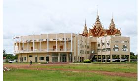 Ex-Khmer Rouge leader says will unveil new secrets at trial