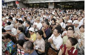 Voters listen to election speech at Tokyo's Shinjuku