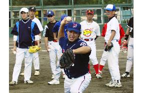Japan baseball pros start teaching adults better ways to play ball