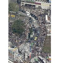 People listen to LDP presidential candidate's speech in Tokyo