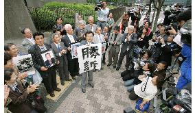 Refusal to pay benefits to overseas 'hibakusha' declared illegal