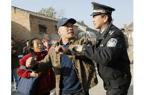 Last man resisting eviction for Beijing Olympics removed