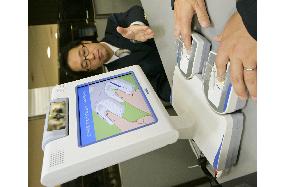 Immigration fingerprinting, photographing device on display