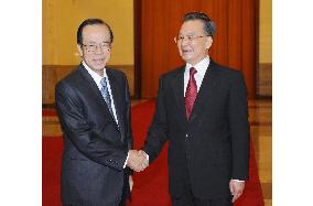 Fukuda, Wen agree to cooperate in enhancing bilateral relations