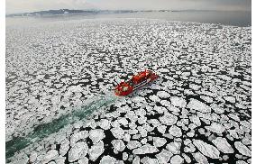 Tourists watch drift ice off Hokkaido