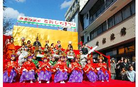 Children in kimono play dolls at Dolls Festival in Gunma