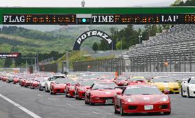 Ferraris rev up for Guinness world record in car parade