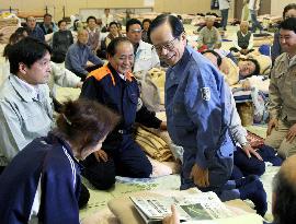 Fukuda visits quake-hit area, vows to restore lifelines