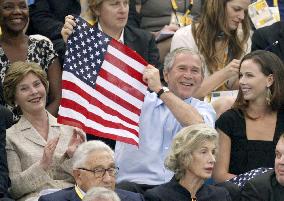 Bush, wife root for American swimmers at Beijing Olympics