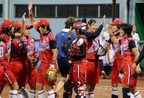 Japan keeps unbeaten record in softball