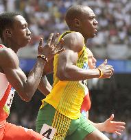 Jamaica's Bolt easily advances to 2nd-round 200-meter heat