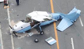 Light plane crashes onto nat'l highway in Osaka Pref.