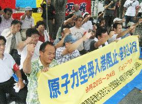 Citizens demonstrate against U.S. carrier's arrival
