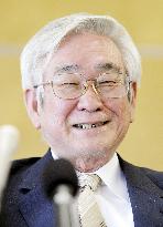 Masukawa smiles in connection with Nobel Prize