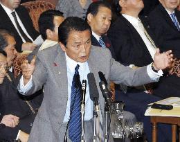 Aso expresses 'dissatisfaction' over U.S. delisting of N. Korea