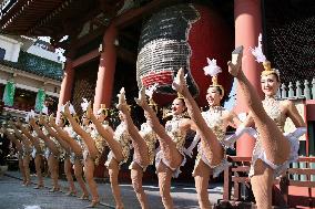 Dancers perform in front of Sensoji Temple gate