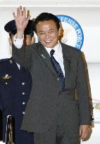Aso heads for Washington to attend global financial summit