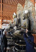 Buddha statues at Horyuji Temple cleaned in year-end event