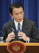 Aso unveils 23 trillion yen stimulus package