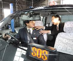 Osaka taxi firm unveils new anticrime device featuring light, sound