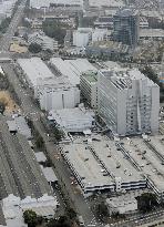 Toyota to halve domestic output, suspends factory operations