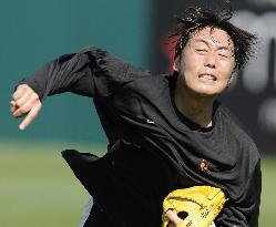 Baltimore's Uehara pitches during independent training