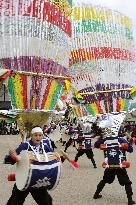 'Feather' men dance at spring festival in Gifu