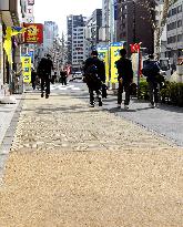 Wooden sidewalk drawing attention as tool to cool down Tokyo