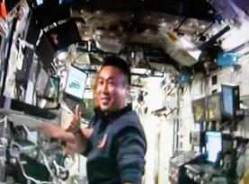 Astronauts install solar arrays on space station
