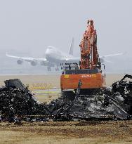 Narita reopens main Runway A after removing cargo plane wreckage