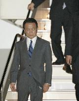 Aso returns home after cancellations of Asian summits in Thailand