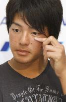 Teen golf player Ishikawa returns home