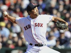Red Sox's Saito earns his first save against Orioles