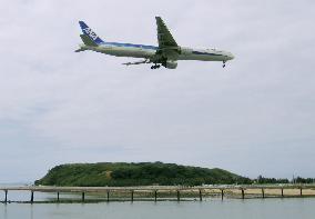 Okinawa island overcomes runway expansion dispute, finds hot spring
