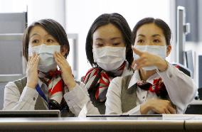 Officials, public gear up for possible swine flu in Japan